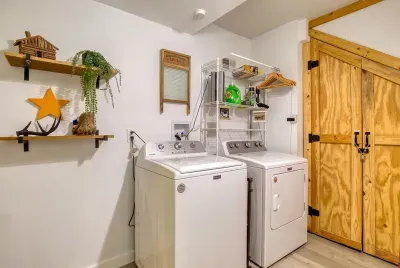 Full-size washer and dryer behind barn doors, detergent stocked. Pack light, stay longer, and drive home with a clean suitcase — long weekends just got easier.