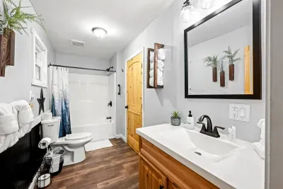 Full bath with a shower-tub combo, wide vanity, and space to spread out. Rinse the trail off, wrap up in a warm towel, and head straight for the hot tub.