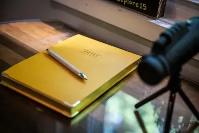 A spotting scope at the window and a guest notebook full of trail tips, favorite diners, and where the deer show up at dusk. Add your chapter before you go.