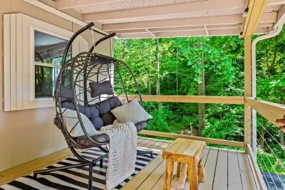 Hanging egg chair on the private deck, forest pressing in on all sides. Coffee in the morning, wine at dusk, and the gentle sway that makes time disappear.
