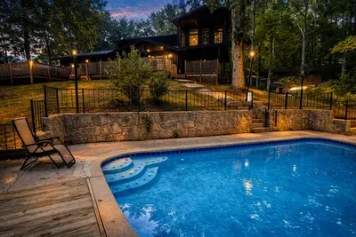A pool, a cabin, and the soft glow of dusk — paradise found