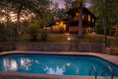 Twilight whispers, water glimmers, and the cabin calls for cozy moments.
