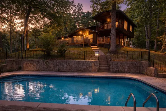 Twilight whispers, water glimmers, and the cabin calls for cozy moments.