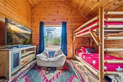Sleep, relax, and catch your favorite shows—two double bunk beds with a TV.