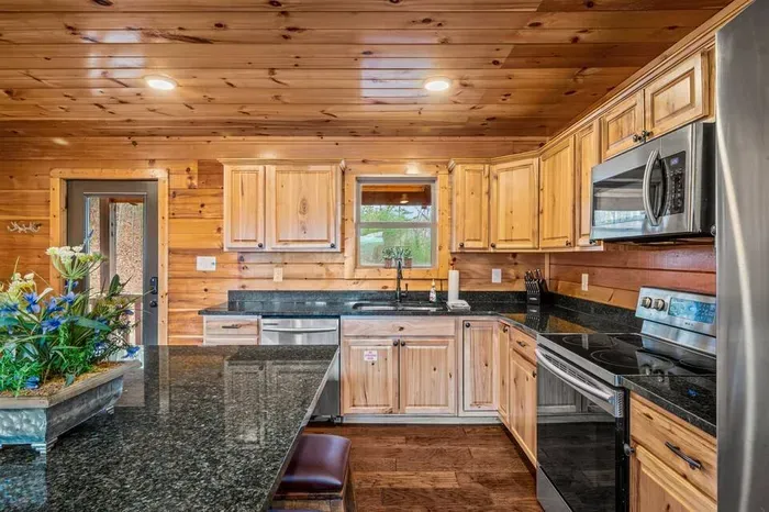 The heart of the cabin—kitchen, table, and living room all in one cozy space