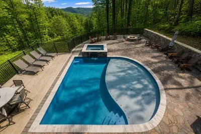 Dive in, soak up, and take in the view behind your cozy cabin