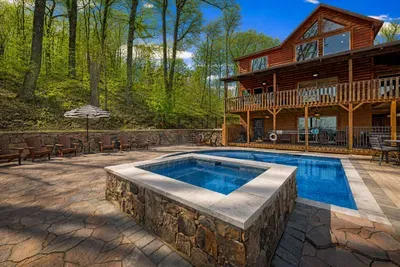 Where luxury meets nature—soak, unwind, and enjoy the cabin backdrop.