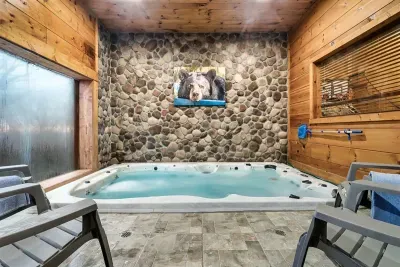 Indoor swimming pool is 4 feet deep, and can accommodate 8 people. Kept at a warm 92 degrees...not a hot tub, but definitely comfortable!  Pool room has lock for security. CHILDREN SHOULD HAVE