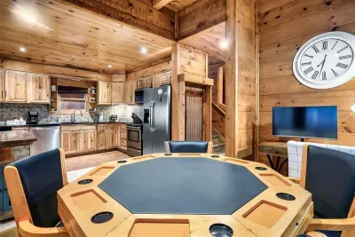 Game table with poker chips and cards.  It has 4 chairs, but 8 people can play!  You can flip the table over and you will find bumper pool.  Or, you can flip it over again, and it is a flat su