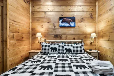 Lower level bedroom includes a king bed, en suite bathroom, and smart TV
