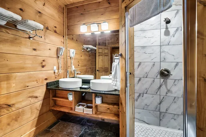 Upper level 2nd bedroom en suite bathroom.  Updated bathroom!