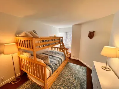 Guest bedroom 2 with a full sixed + Twin bunk bed and pullout mattress below.