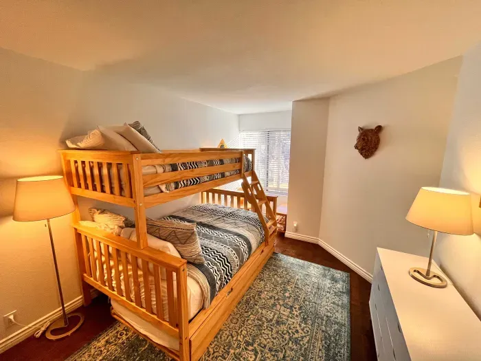 Guest bedroom 2 with a full sixed + Twin bunk bed and pullout mattress below.