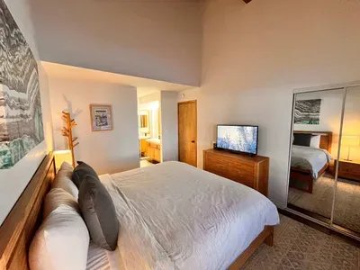 Primary bedroom 1 with King bed and attached private bathroom