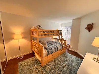 Guest bedroom 2 with a full sixed + Twin bunk bed and pullout mattress below.