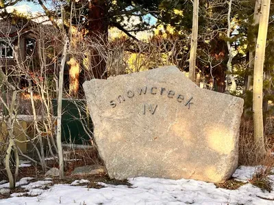 Snowcreek IV welcome sign at entrance to complex
