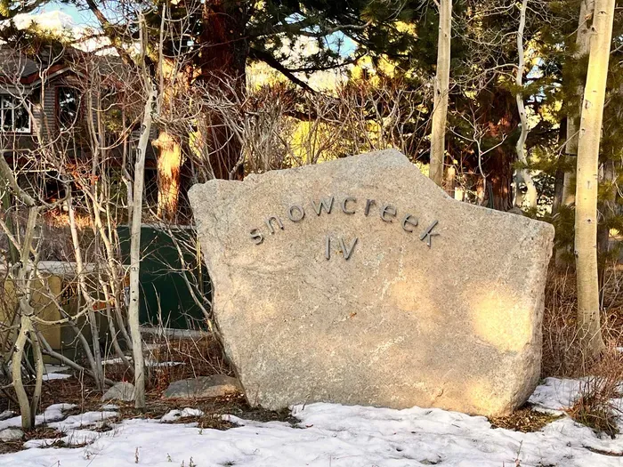 Snowcreek IV welcome sign at entrance to complex