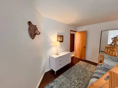 Guest bedroom 2 with a full sixed + Twin bunk bed and pullout mattress below.