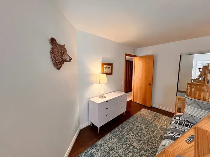 Guest bedroom 2 with a full sixed + Twin bunk bed and pullout mattress below.