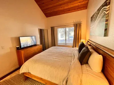 Primary bedroom 1 with King bed and attached private bathroom