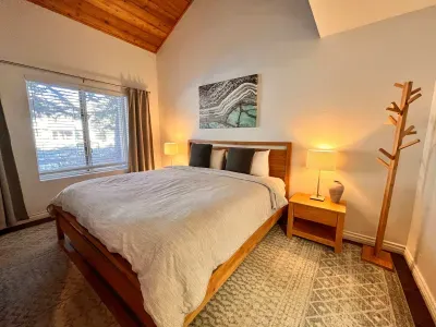 Primary Bedroom with king sized bed and attached private bathroom.