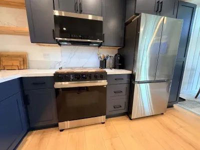 Electric Range, Microwave and Full Sized Refridgerator/Freezer in Kitchen