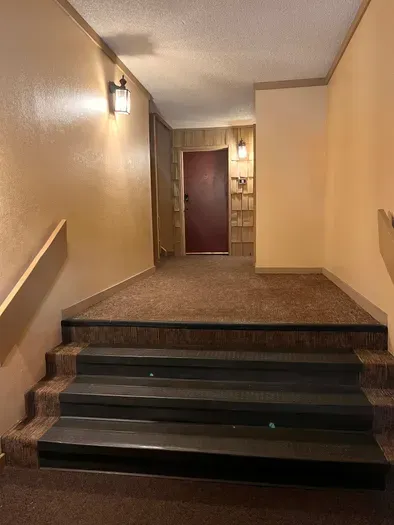 Staircase to Front Door of Condo