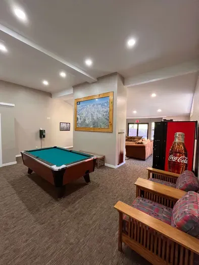 Rec Room with Couches TV, Pool Table and Soda vending machine.  This is a sharred rec room availabe to all guests in the complex.  Open from 10am to 10pm