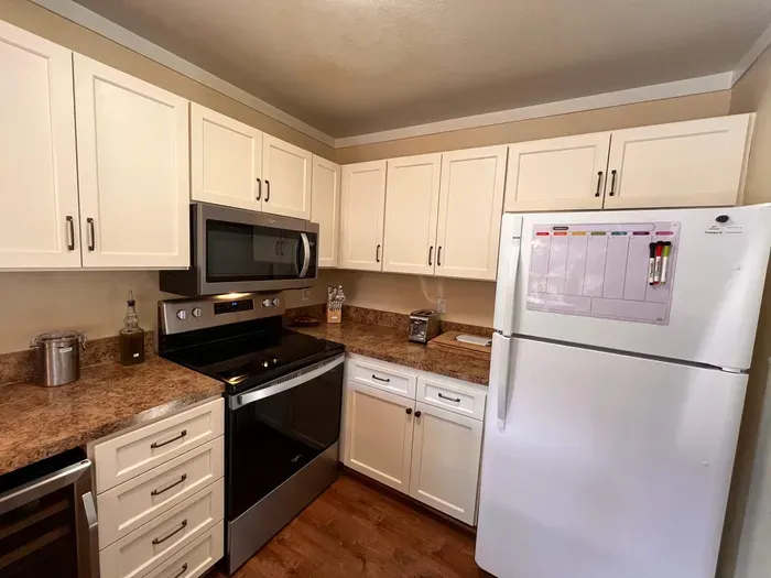 Fully stocked kitchen with upgraded appliances.