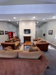Rec Room with Couches TV, Pool Table and Soda vending machine.  This is a sharred rec room availabe to all guests in the complex.  Open from 10am to 10pm