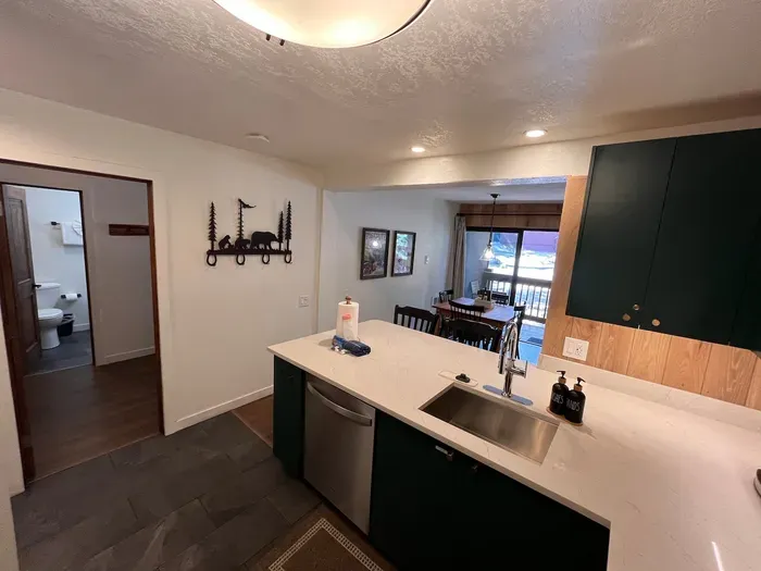 Fully stocked ktchen with stainless steel appliances, quartz countertop and custom cabnets.