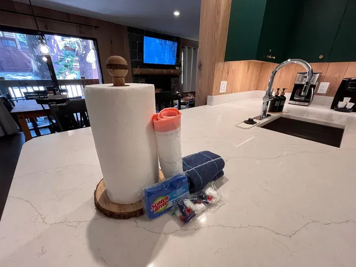 Over sized quartz counter, breakfast bar and provided kitchen supplies