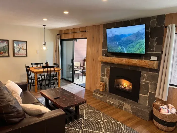 Living room, dining table and private balcony