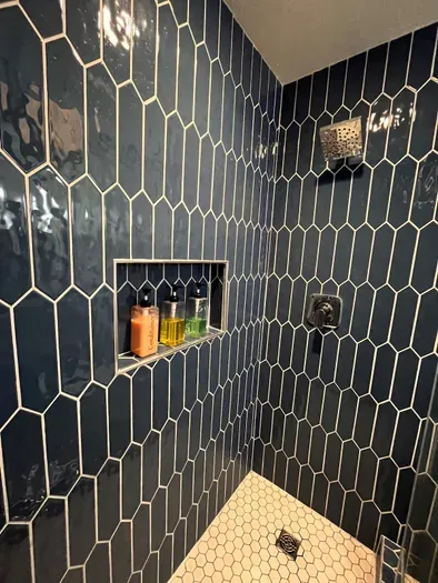 Bedroom bathroom with walk in shower and full glass shower enclosure