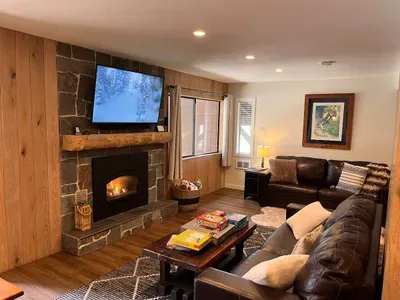 55" smart TV, Gas fireplace and 2 full leather couches