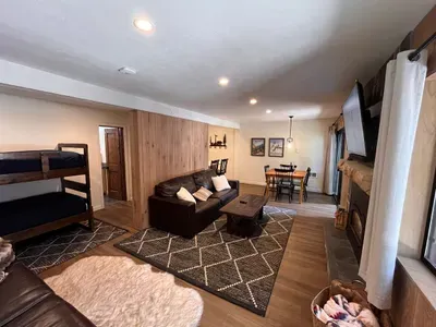 Living room, bunkbed nook and bathroom