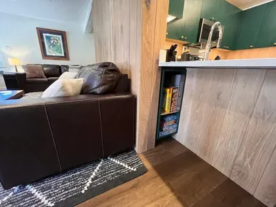 Games and puzzle storage under breakfast bar