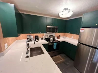 Fully stocked ktchen with stainless steel appliances, quartz countertop and custom cabnets.