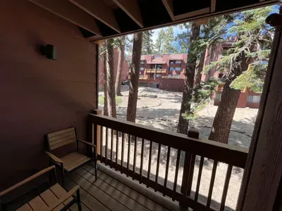 Private balcony with chairs and end table