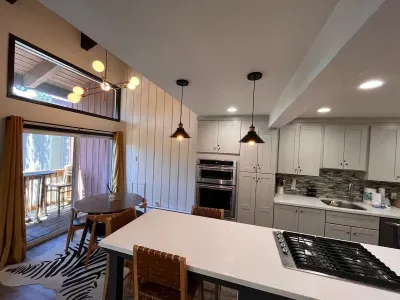 Dining area and private deck viewed from living room.