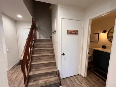 Entrance to condo, stairs to upstairs bedroom/loft and mudroom (storage for jackets, skis, boards, boots and poles).