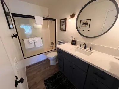 Upstairs full bathroom.  Shower is equipted with Bodywash, Shampoo and Conditioner.  Vanity has dispensers  with hand soap and body lotion.  Upstairs bathroom can be accessed from either the hallway or bedroom.