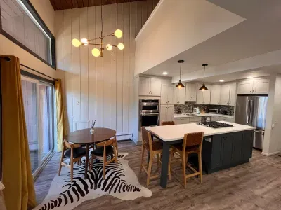 Dining table with seating for 4 and kitchen island seating with 3 high top chairs.