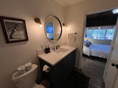 Upstairs bathroom view of vanity and attached bedroom.