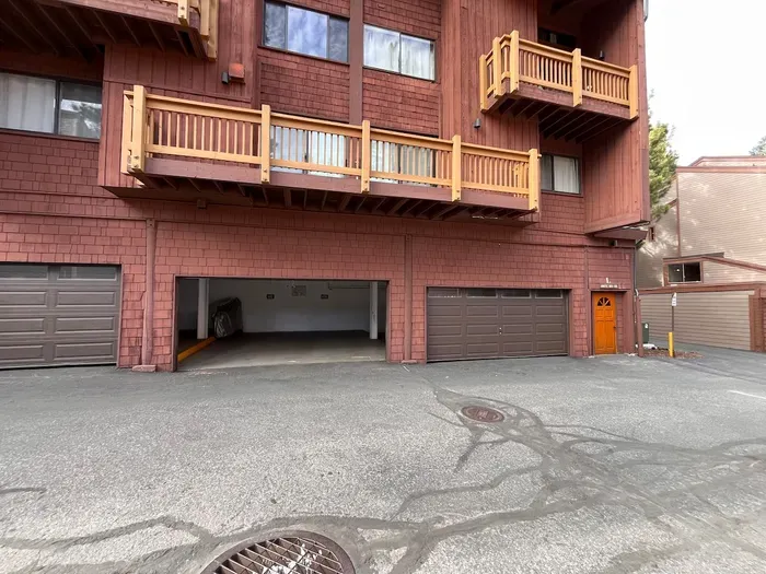 View of garage door used for the condo.  Must manually open and close to gain access. Please park in spot marked "108".