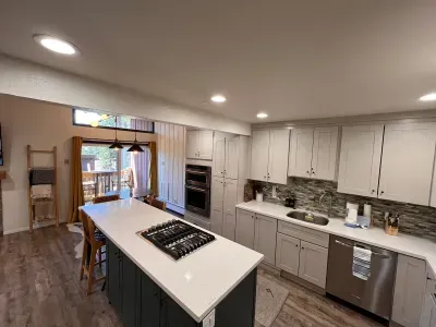 Full kitchen with gas stove, stainless steel apliances and quartz counters.
