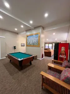 Lounge area available to all guests in the complex. Pool table ($1.00/game),  soda machine ($1.00/soda), change machine, couches with TV.
