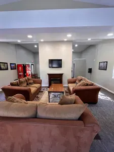 Lounge area available to all guests in the complex. Pool table ($1.00/game),  soda machine ($1.00/soda), change machine, couches with TV.