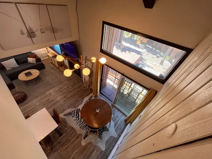Dining area and living room viewed from upstairs loft.