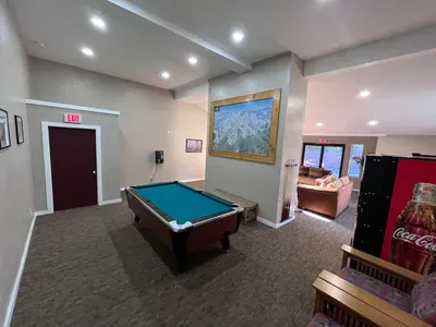 Lounge area available to all guests in the complex. Pool table ($1.00/game),  soda machine ($1.00/soda), change machine, couches with TV.